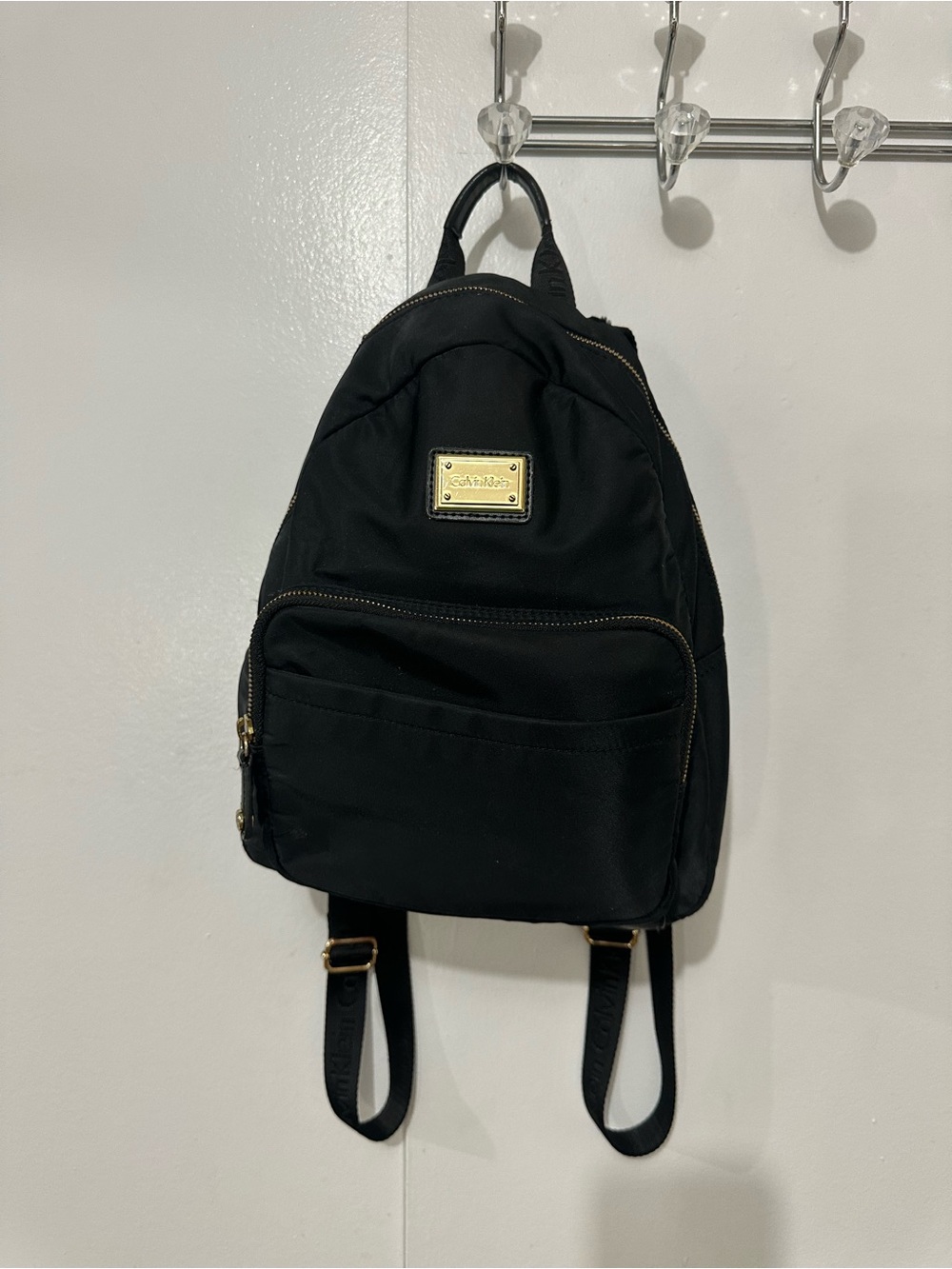 Calvin Klein Black Mini Backpack with Gold Plaque